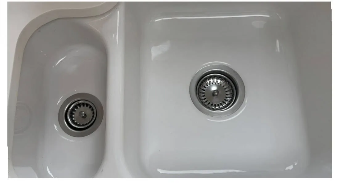 Pristine white double kitchen sink after deep clean by True Grit Cleaning Co in Richmond, North Yorkshire