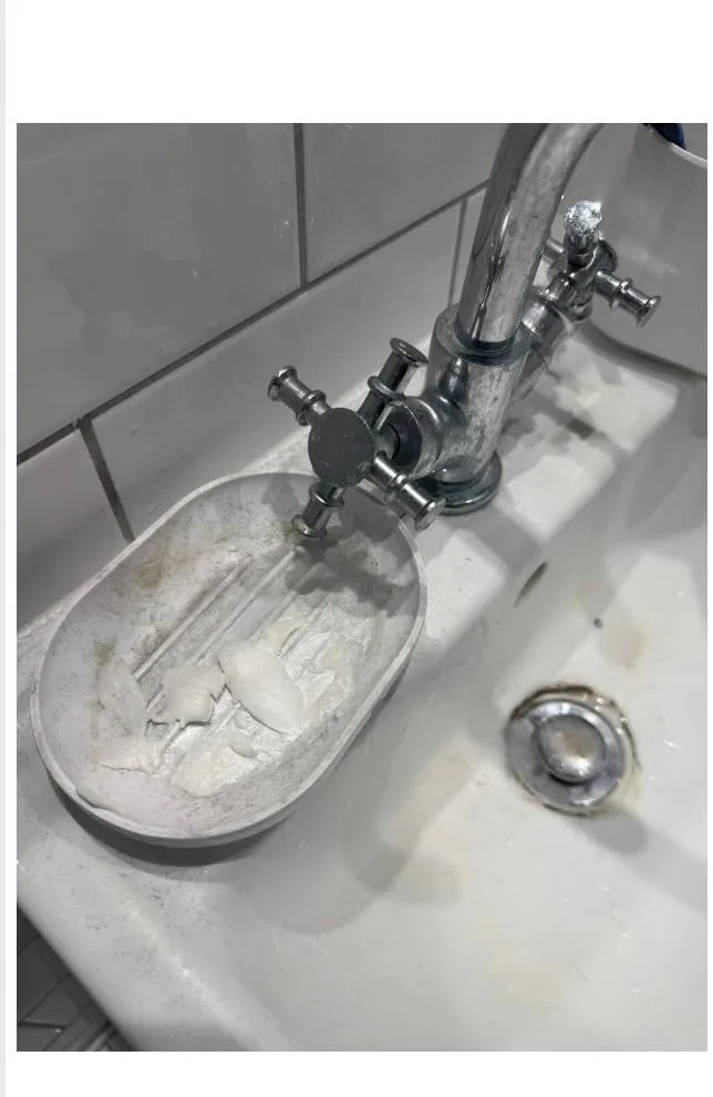 Bathroom tap caked in limescale and a dirty soap dish before deep clean by True Grit Cleaning Co