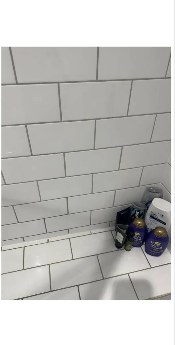 Bright white shower tile grout after professional grout cleaning by True Grit Cleaning Co in North Yorkshire