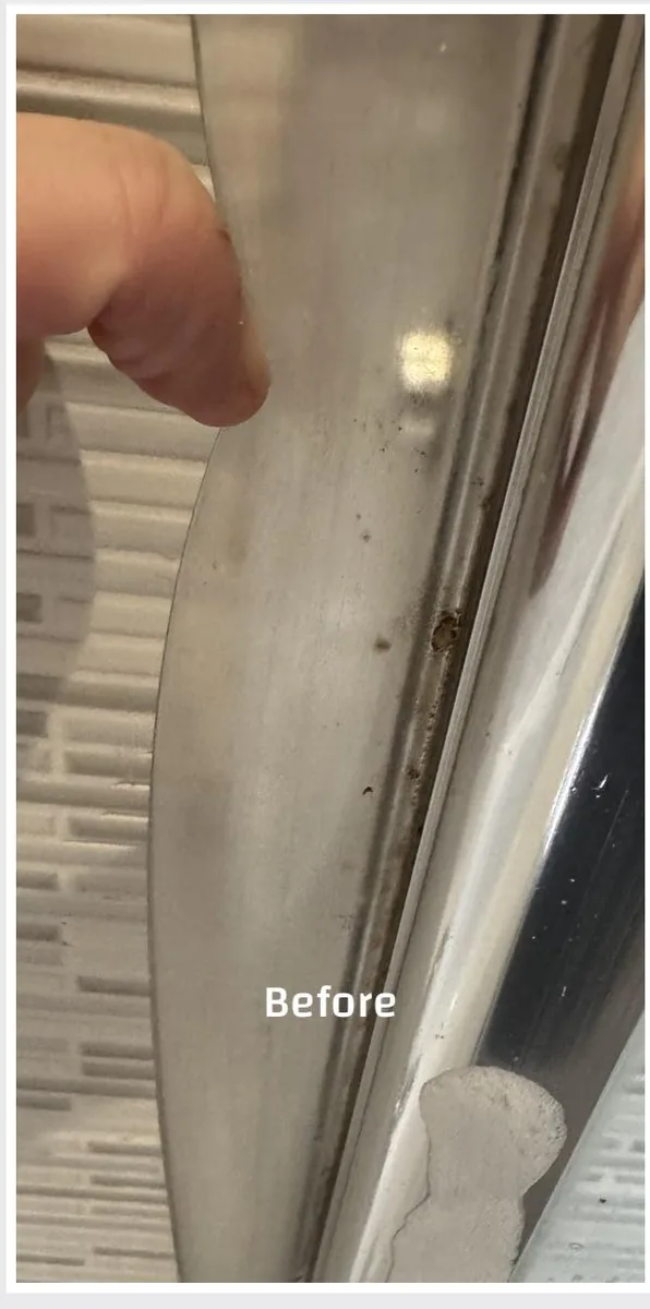 Dirty chrome shower screen track with soap scum and grime before deep clean by True Grit Cleaning Co