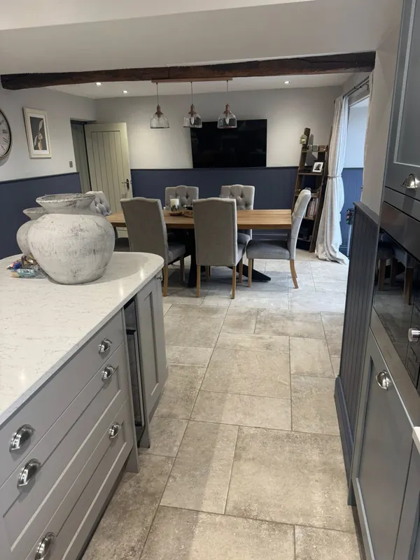 Grey shaker kitchen with stone flagstone floor cleaned to holiday let standard by True Grit Cleaning Co in the Yorkshire Dales